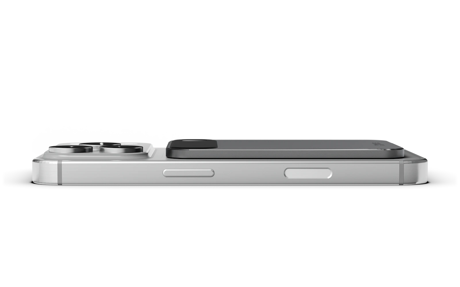 Pre-production XNote Voice attached magnetically to the back of a phone, seen from the side. Phone not included.