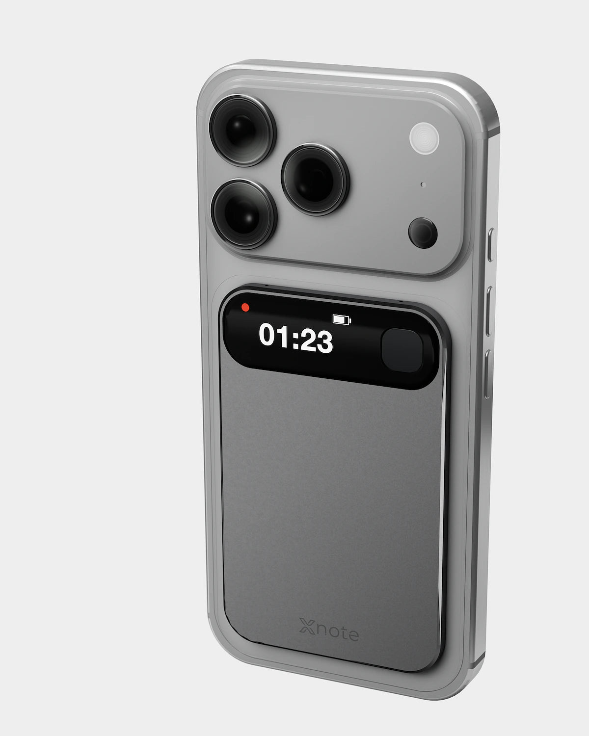 Pre-production XNote Voice on the back of a phone, display showing a red dot and 01:23. Phone not included.
